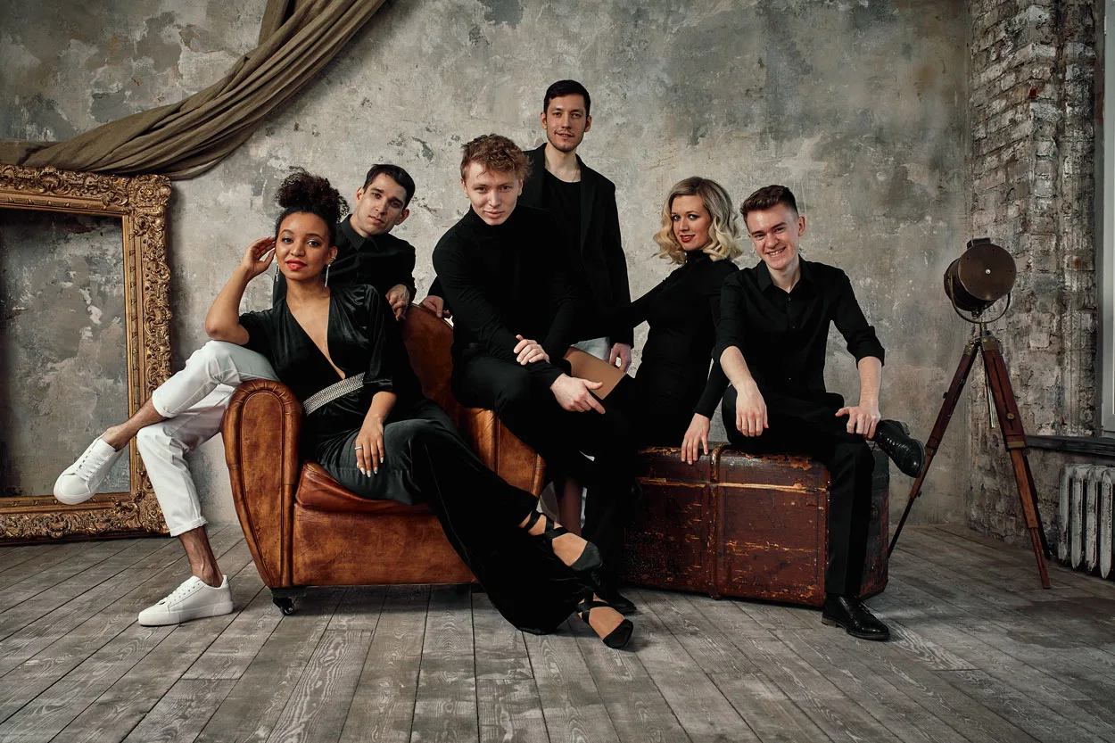 multi-ethnic-jazz-band-posing-on-a-leather-sofa-ag-2025-01-07-18-18-29-utc2.webp